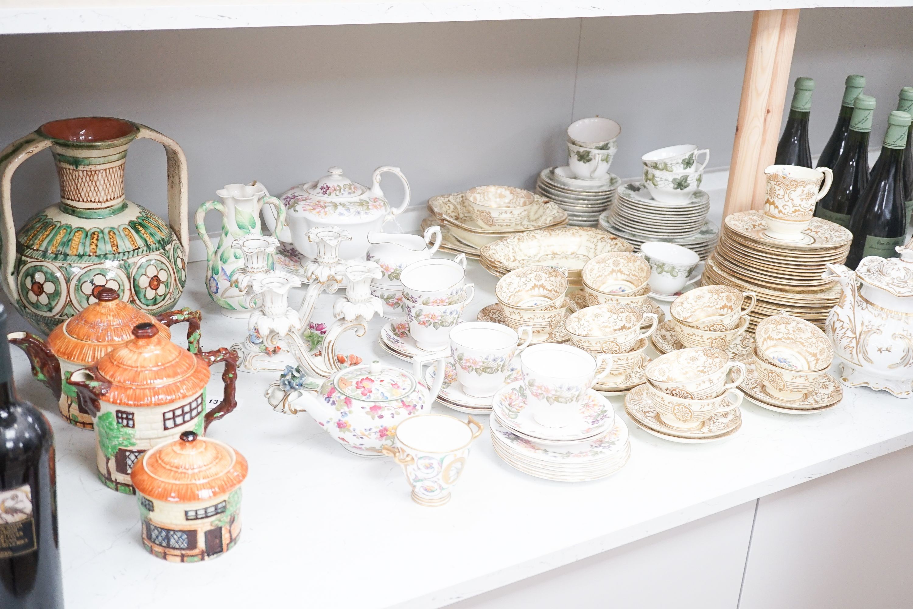 A Crown Staffordshire fifty nine piece part tea set and dessert service, central flowers and gilt borders, a Paragon part tea set and other ceramics